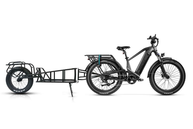 Black Magicycle Deer step-over e-bike with a cargo trailer, perfect for outdoor use.
