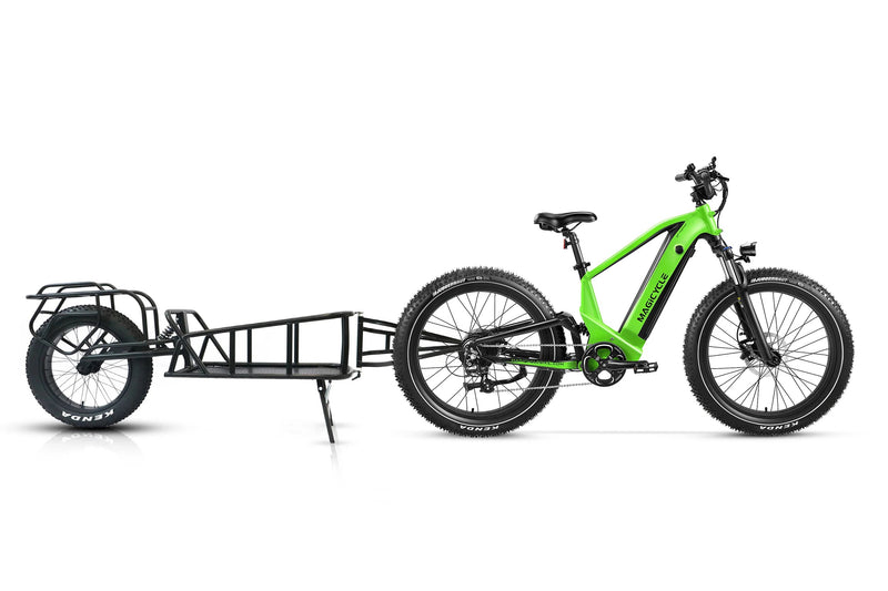 Green Magicycle Deer e-bike with cargo trailer for versatile outdoor exploration.