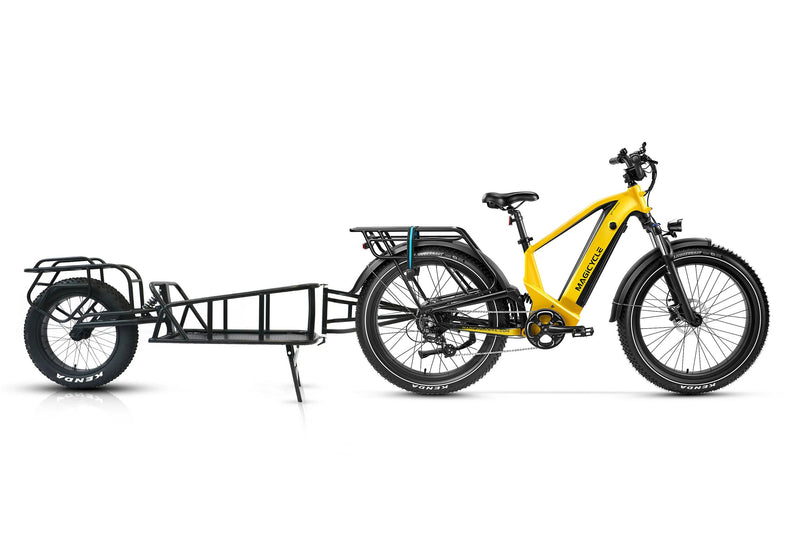 Yellow Magicycle Deer e-bike with cargo trailer for versatile outdoor adventures.