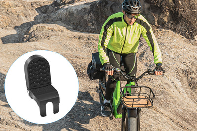 Collapsible footrest peg on an electric bike with rider in bright gear