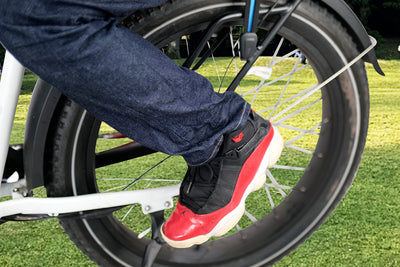 Footrest peg installed on bike with a passenger's foot resting securely