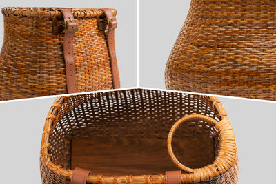 Detailed view of handmade rattan bike basket showcasing cup holder and adjustable straps.