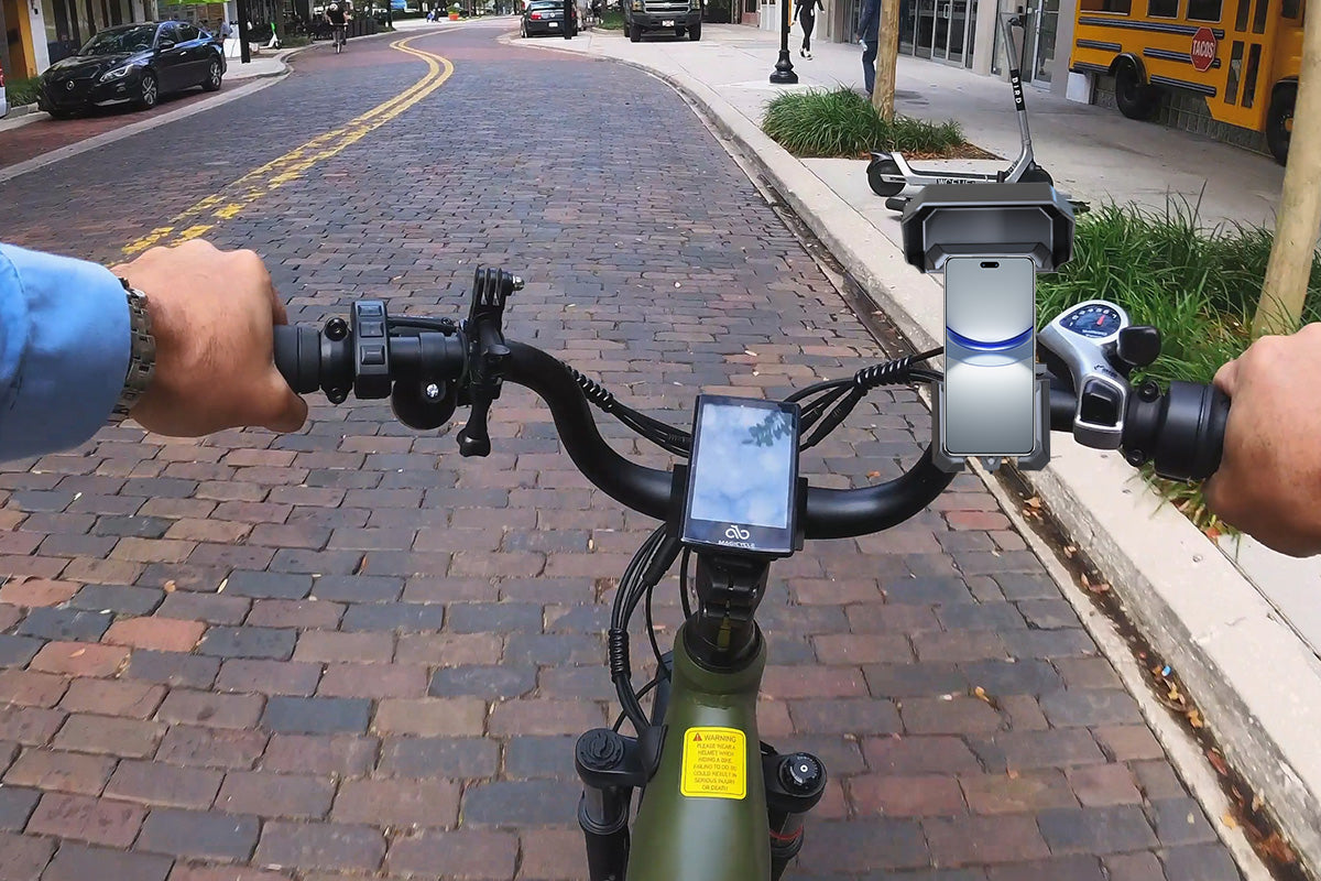 Bike phone mount holding smartphone on handlebars for navigation while cycling.