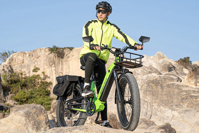 Cyclist in neon jacket riding Magicycle fat tire ebike on rocky terrain