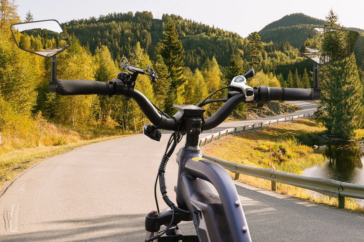 Magicycle ebike handlebars with extra-large mirrors on a scenic forest road
