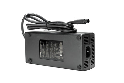 Magicycle electric bike charger with AC power cables and specifications on the back.