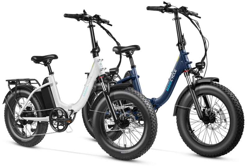 White and navy blue Magicycle Jaguarundi 2.0 fat tire ebikes for adventurous rides.