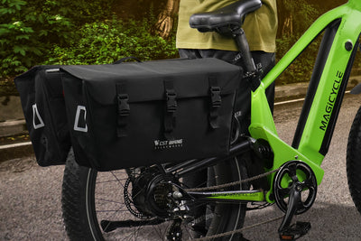Black pannier bags attached to a green electric bike, ideal for ample cargo storage.