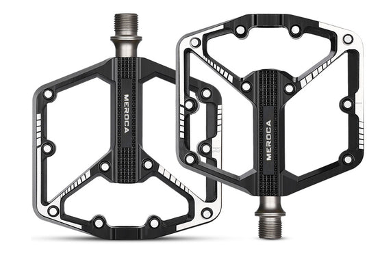Lightweight black and silver bicycle pedals with ergonomic design and 3 bearings.