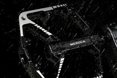 Durable black bicycle pedal with MEROCA branding, designed for wet conditions.