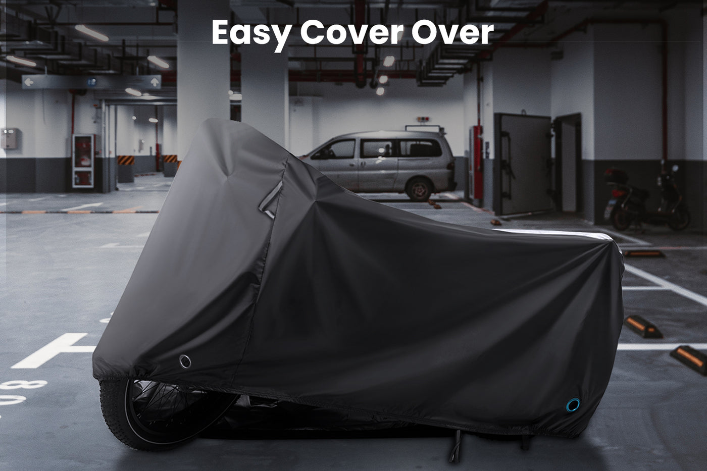 Black waterproof cover on folding electric bike in garage with easy cover over text.