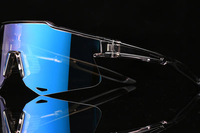 Clear cycling sunglasses with blue photochromic lenses and adjustable frame.