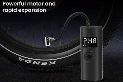 Compact tire inflator displaying 2.48 pressure, ideal for fast inflation on-the-go.