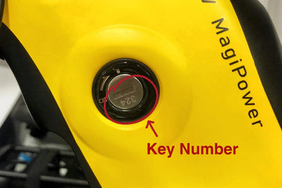 Yellow Magicycle ebike key lock with key number 324 visible for custom orders
