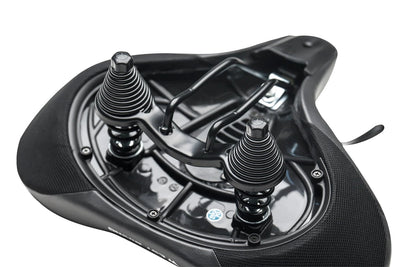 Bottom view of ergonomic oversized e-bike seat with dual spring shock absorbers